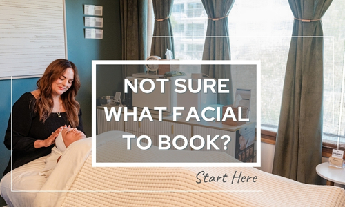 Woman receiving facial evaluation by esthetician at Firefly Spa in San Diego.